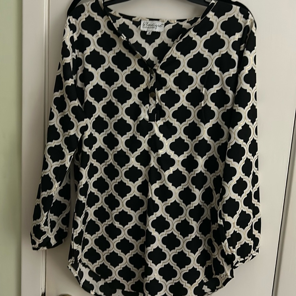 Button down blouse would look good with black or gold leggings